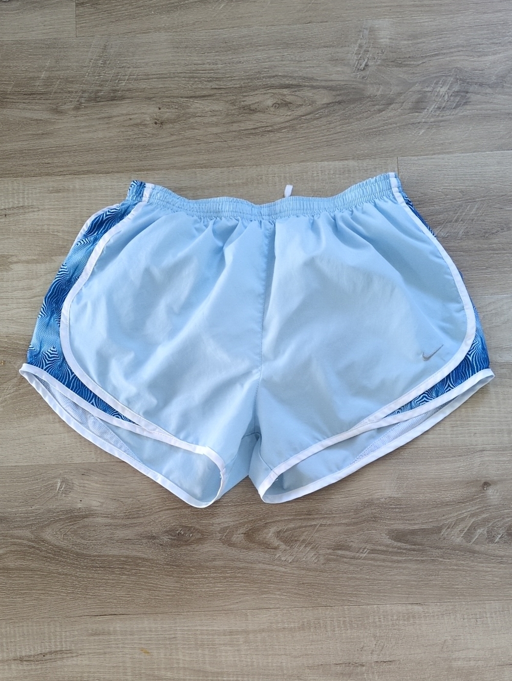 Nike Women's Light Blue Rinning Shorts with Graphic Mesh Side Panels